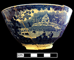 Pearlware London shape bowl printed underglaze in medium blue with pastoral scene.  Same scene on both sides of bowl.  Continuous repeating floral border. 6.5” rim diameter; 3” vessel height.
